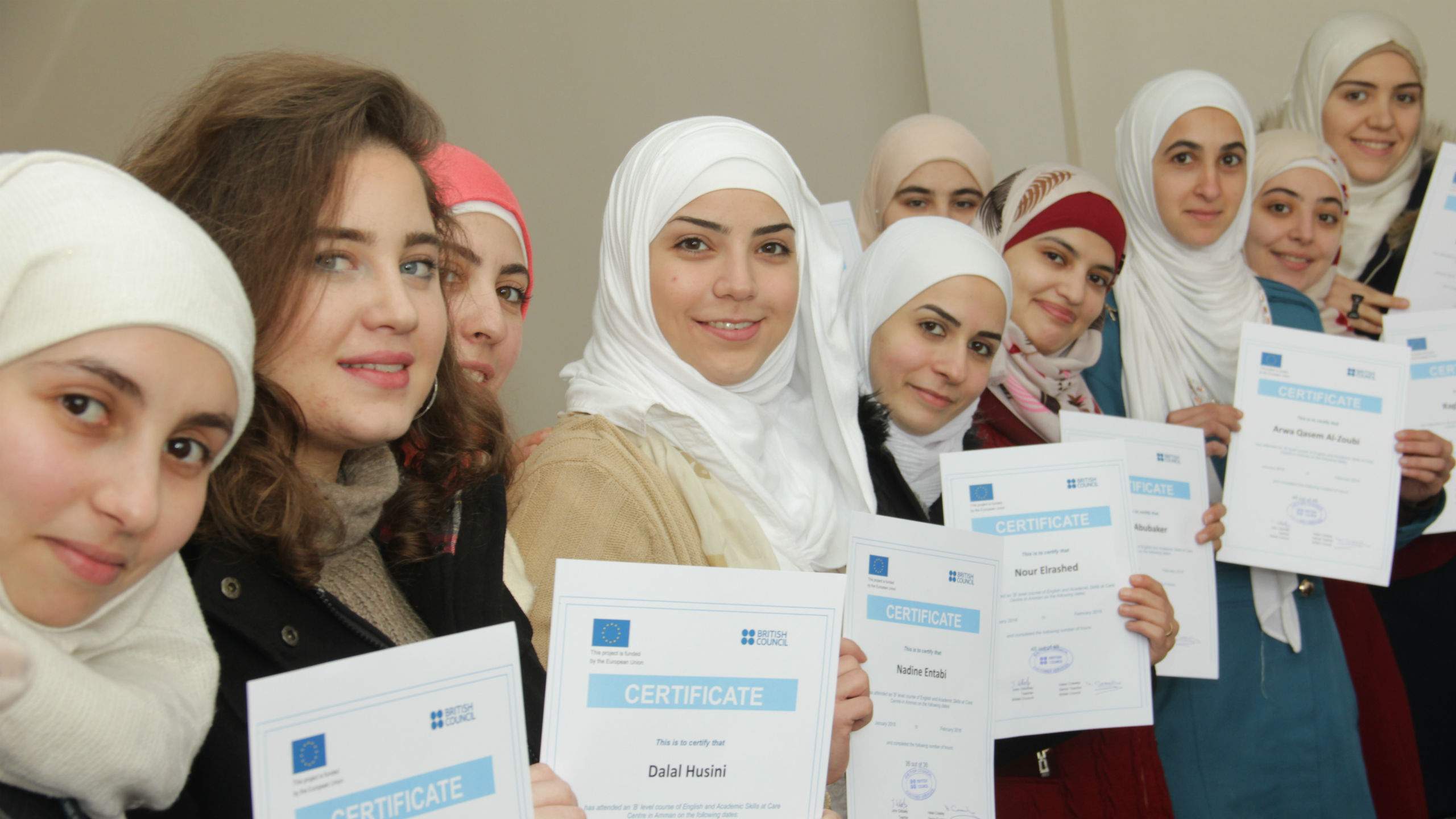 A group of young women posing with British Council certificates.