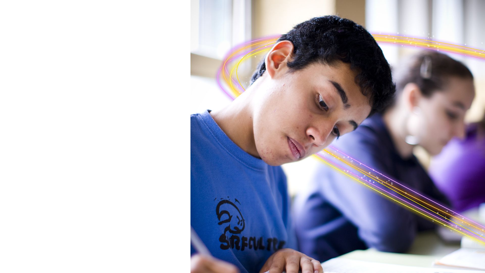 A teenage learner working at a desk.